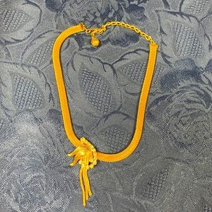 Gold toned choker necklace. Mesh design